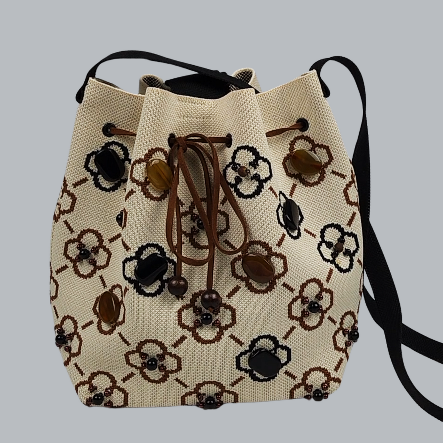 Beige-Black Fabric Bag with Green Pearls-a close-up photo of the bag, foreground
