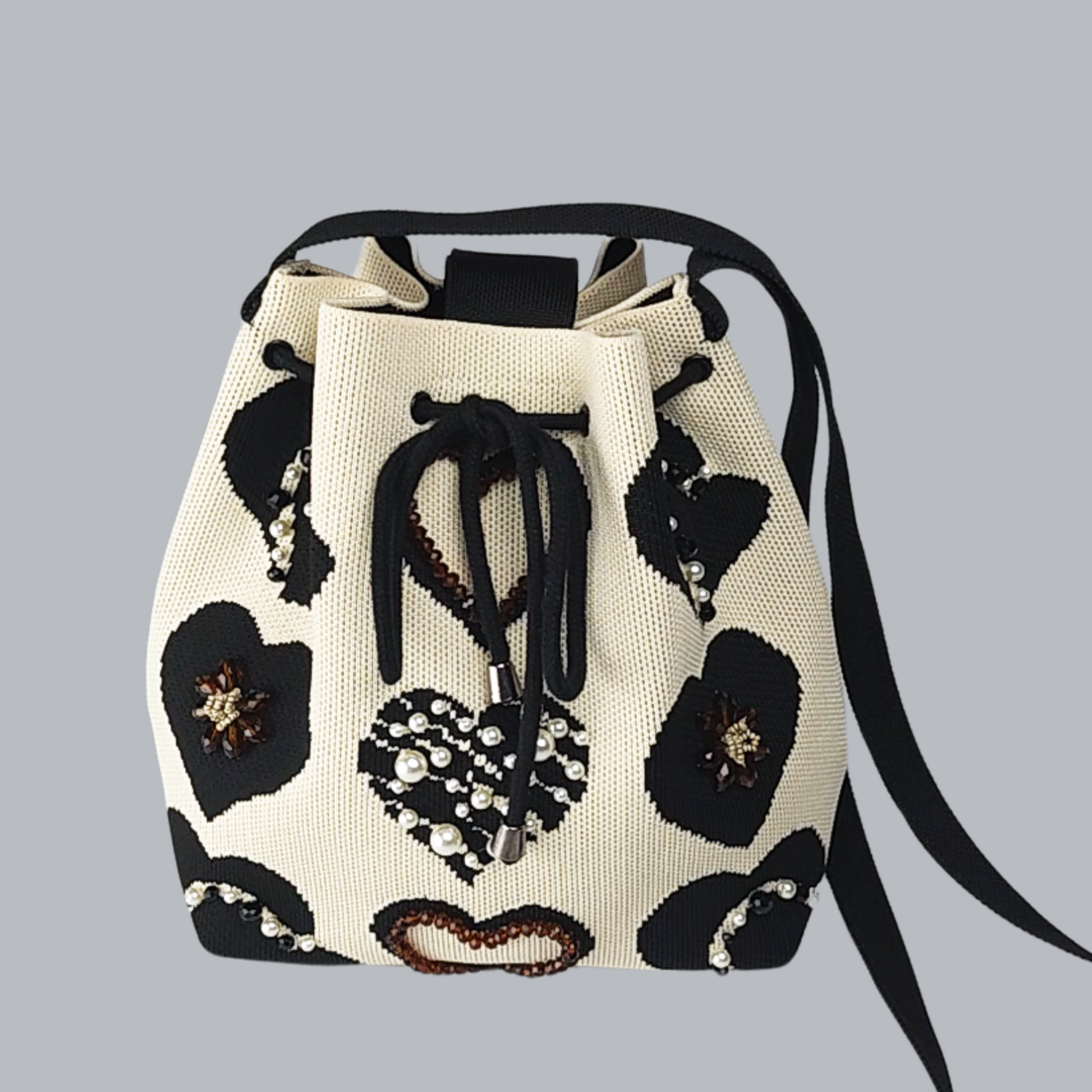 Beige Fabric Bag with Heart Decor-front view of the jewelry