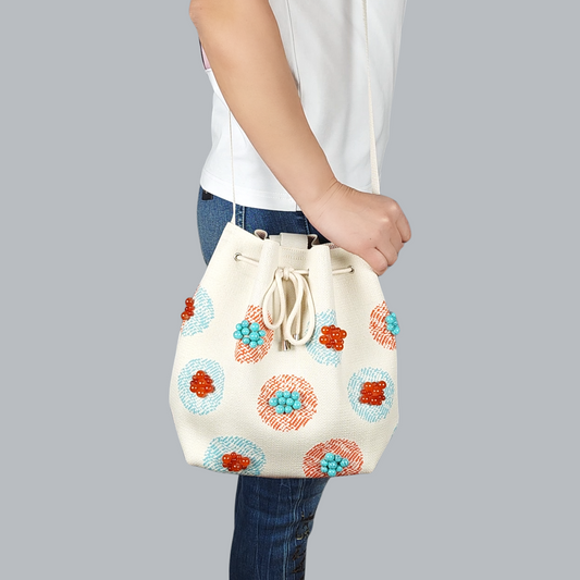 Beige Fabric Bag with Stone Accents-a close up view of the shoulder bag, foreground