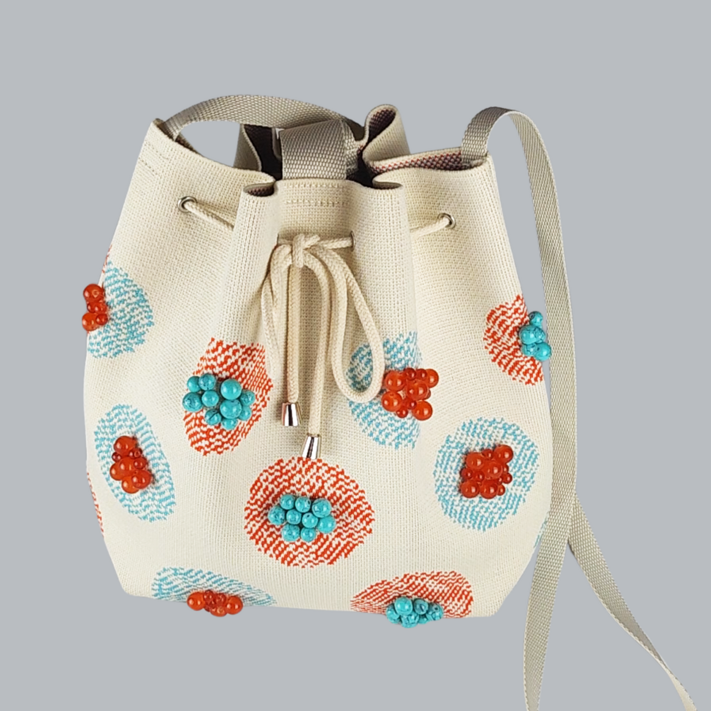 Beige Fabric Bag with Stone Accents-a close-up photo of the bag, foreground
