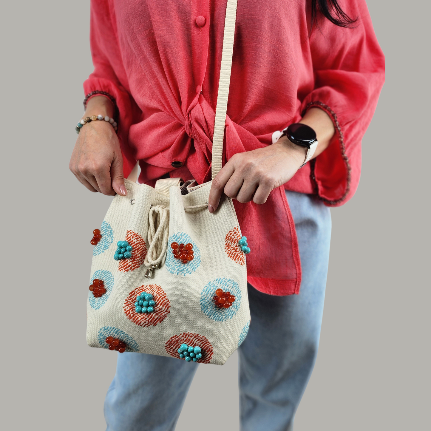 Beige Fabric Bag with Stone Accents-photo of the bag on the model, foreground