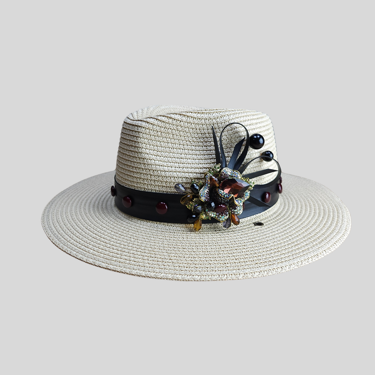 Beige Straw Fedora Hat with Glass Brooch  close up side view of the brooch  