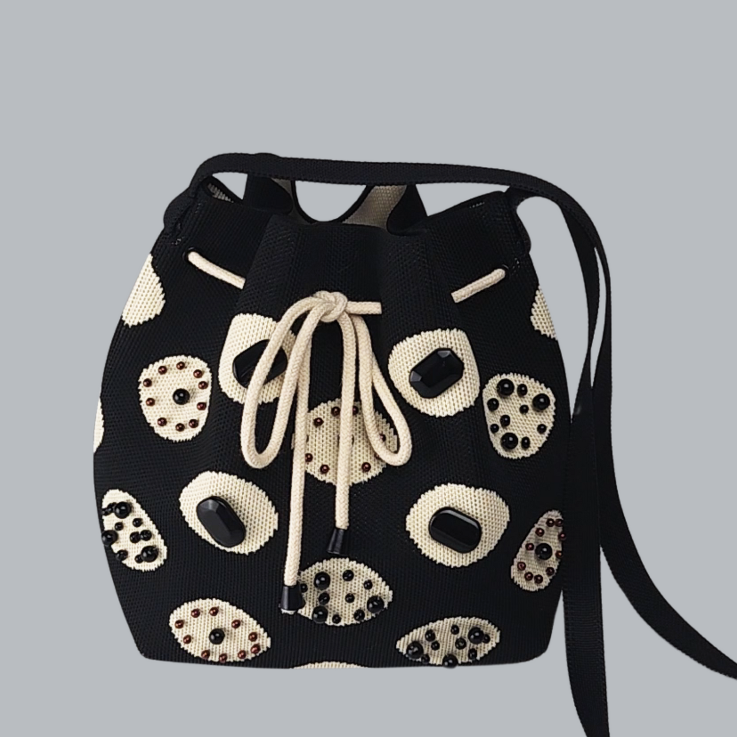 Black Fabric Polka Dot Bag with Pearls and Stones-a close-up photo of the bag, front side 