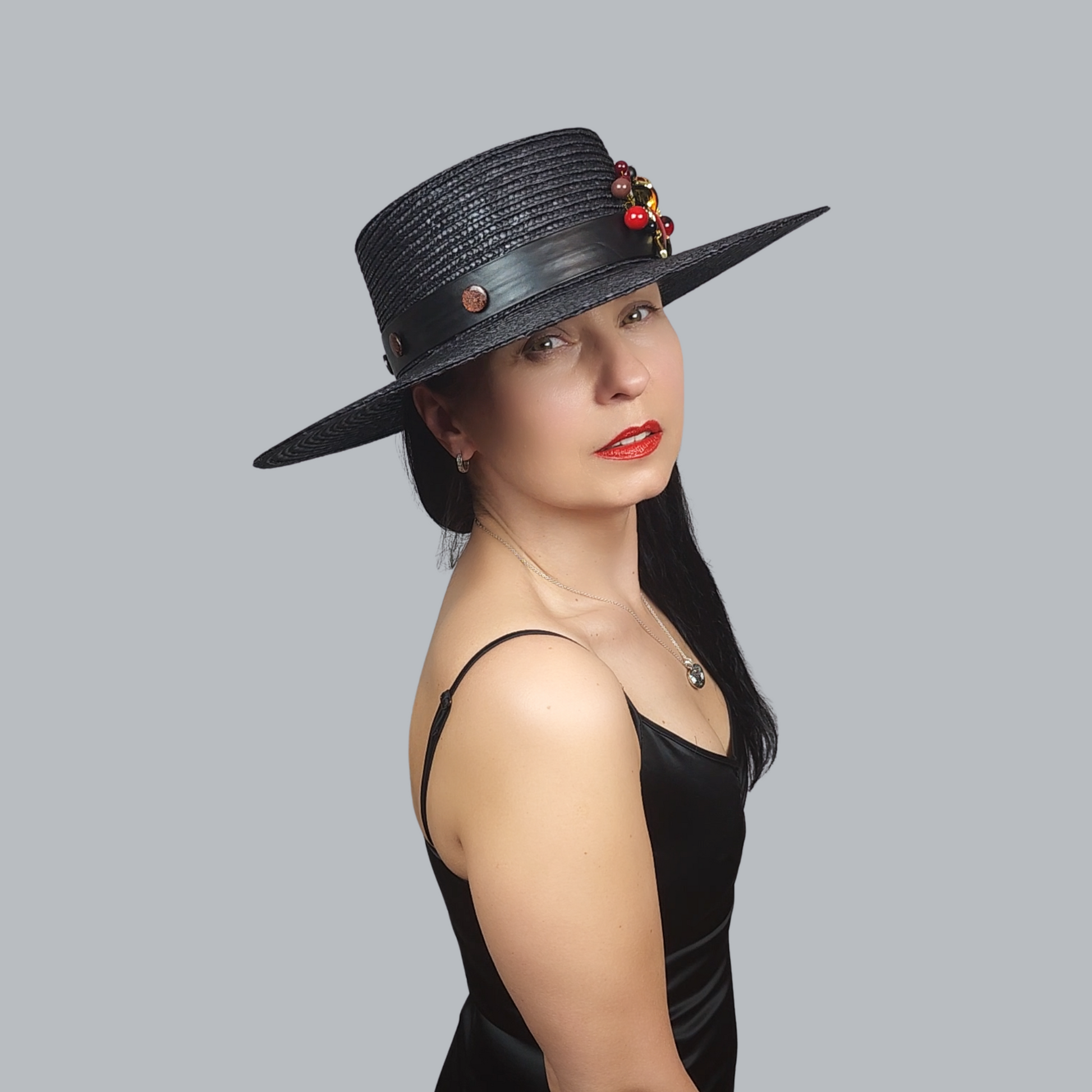 Black Straw Boater Hat with Two-Tone Flower Brooch – side view straight ahead