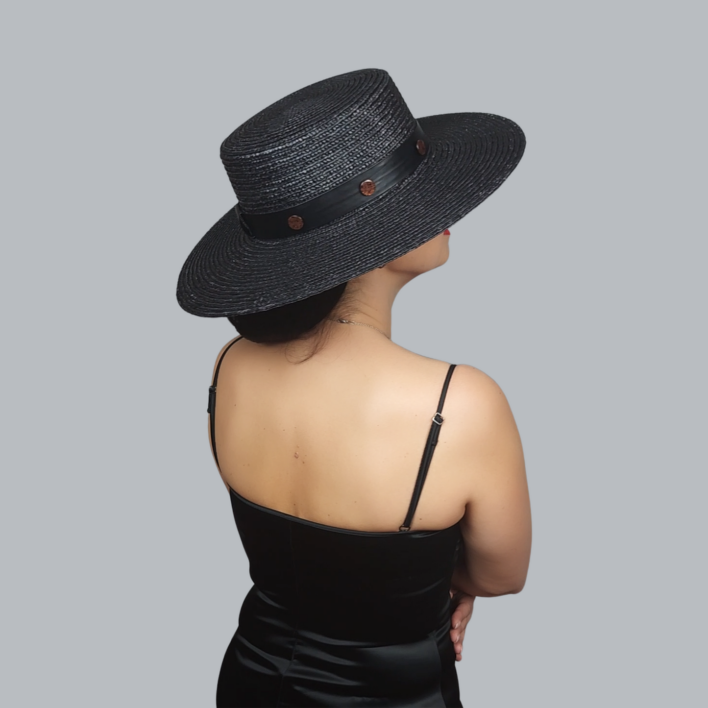 Black Straw Boater Hat with Two-Tone Flower Brooch - side view from the back