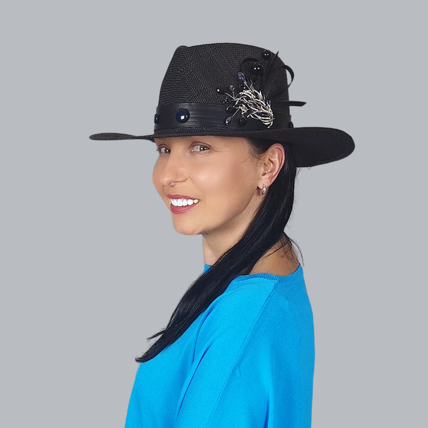 Black Straw Fedora Hat with Brooch close up in profile