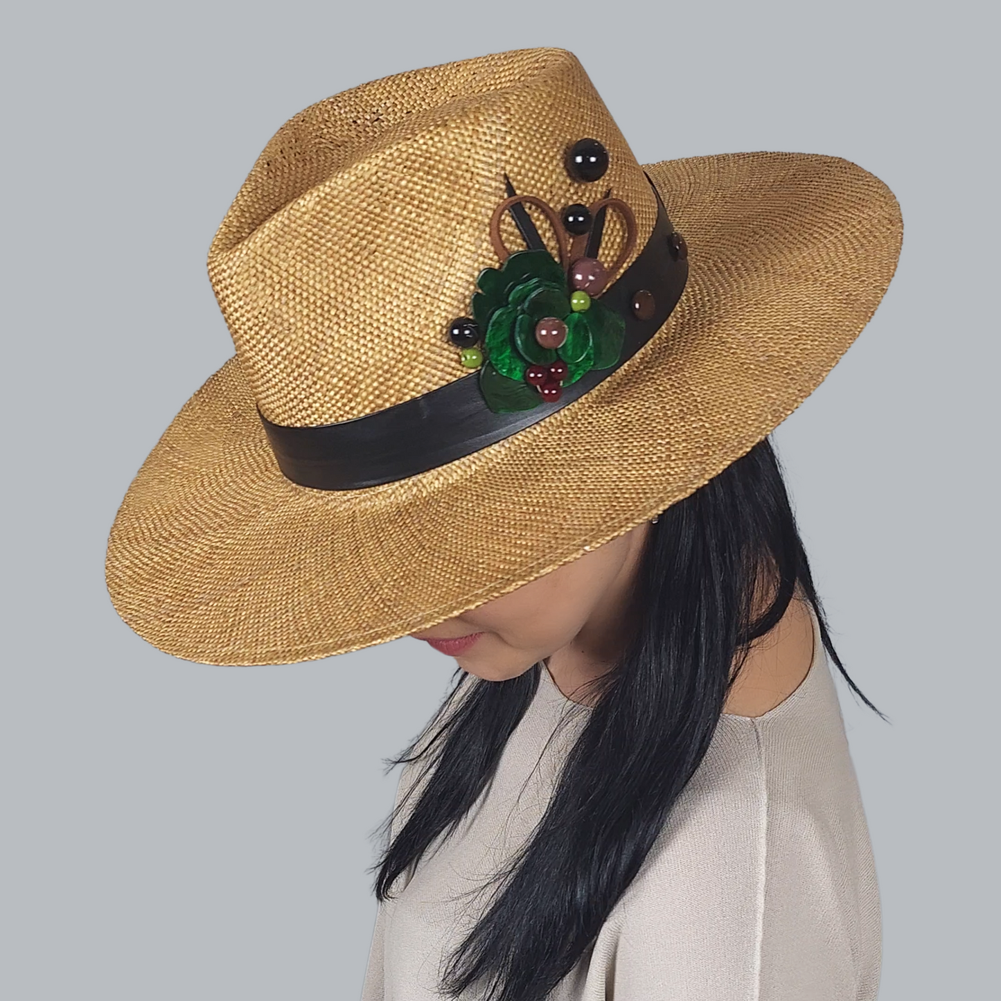 Brown Straw Fedora Hat with Brooch close up view of the brooch
