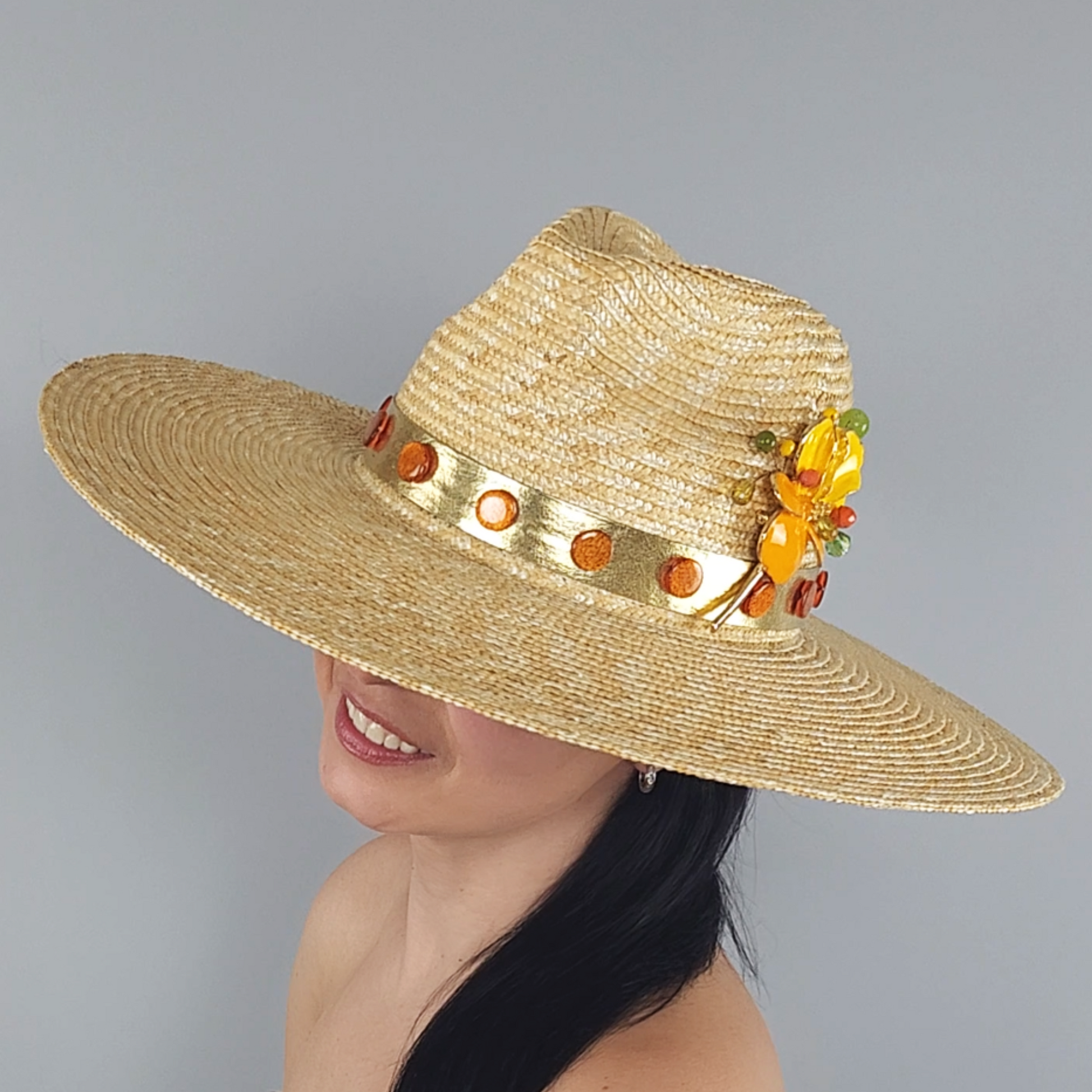 Golden Straw Fedora Hat with Yellow Flower Brooch close profile view