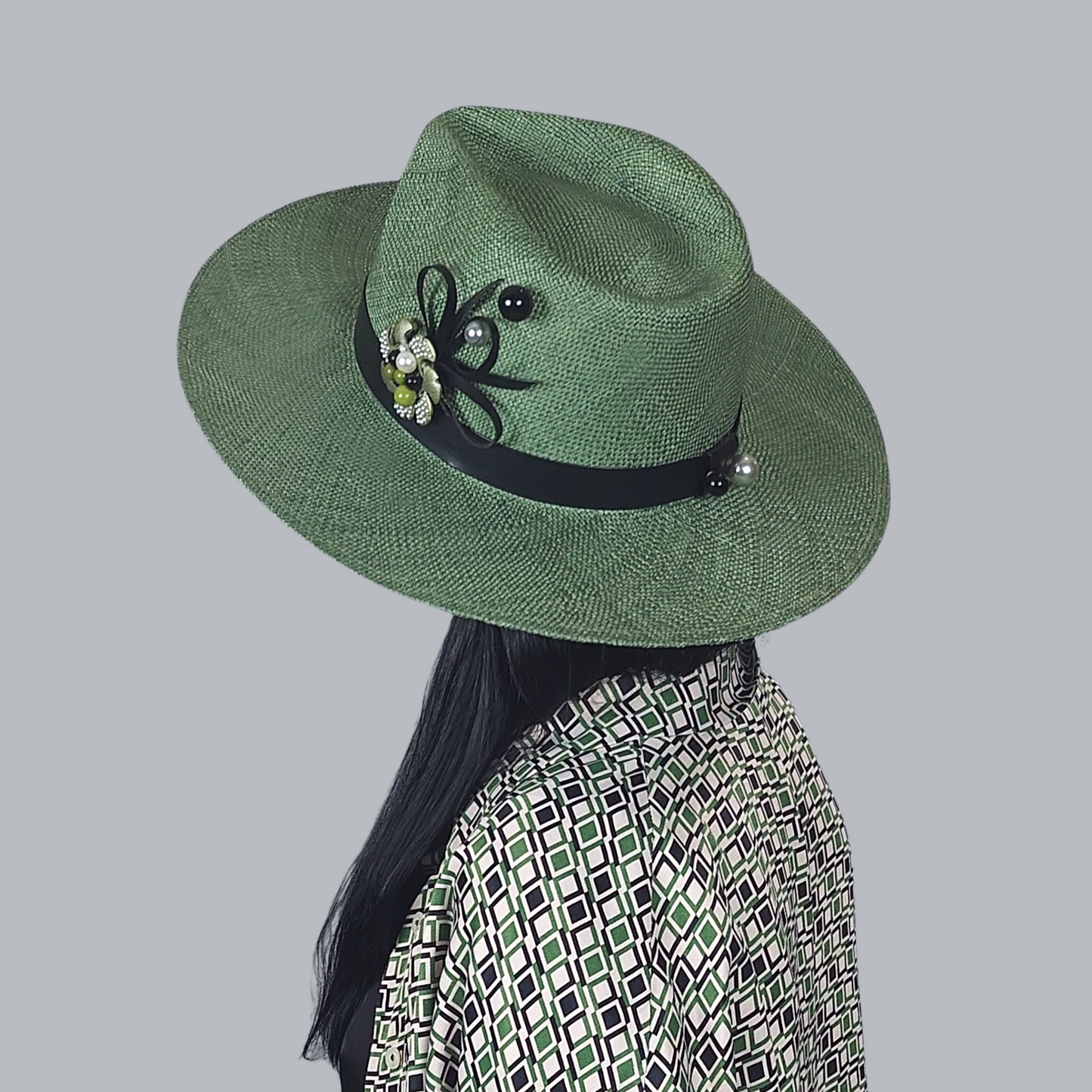 Green Straw Fedora Hat with Brooch close up side view from the back