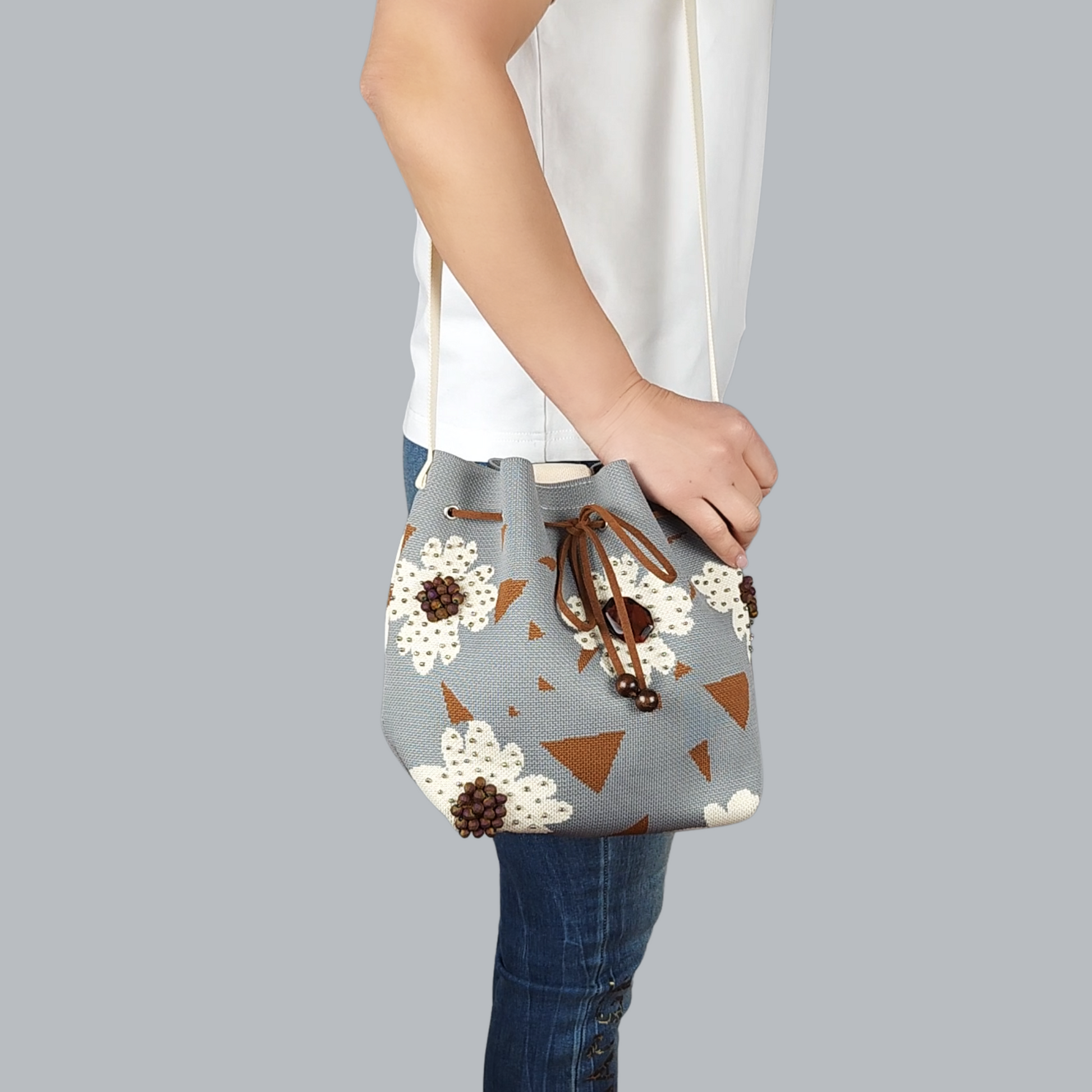 Grey-Beige Fabric Bag with Floral Pattern and Bead Trim-on the shoulder