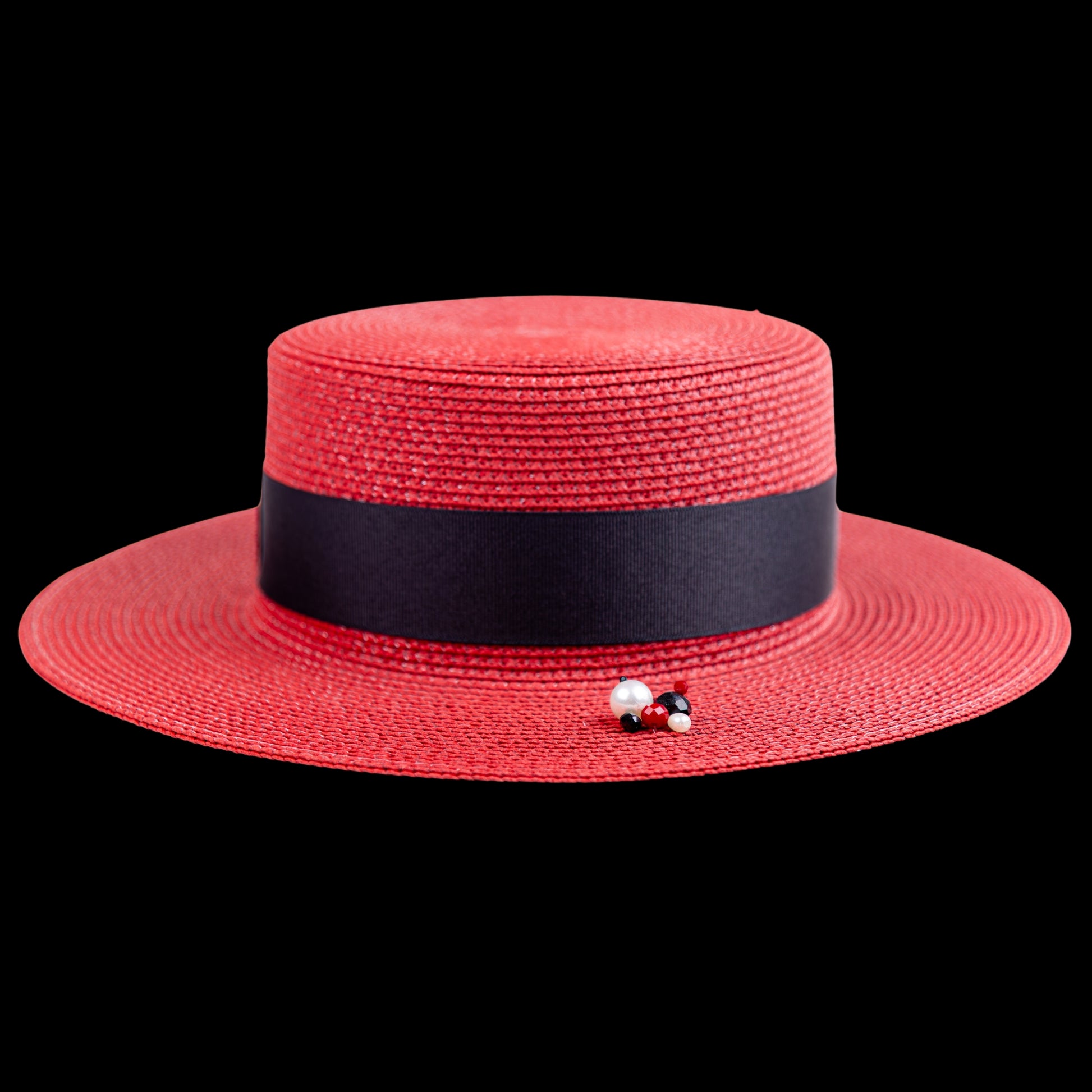 Red Straw Boater Hat with Brooch-photo of the hat backdrop close up 
