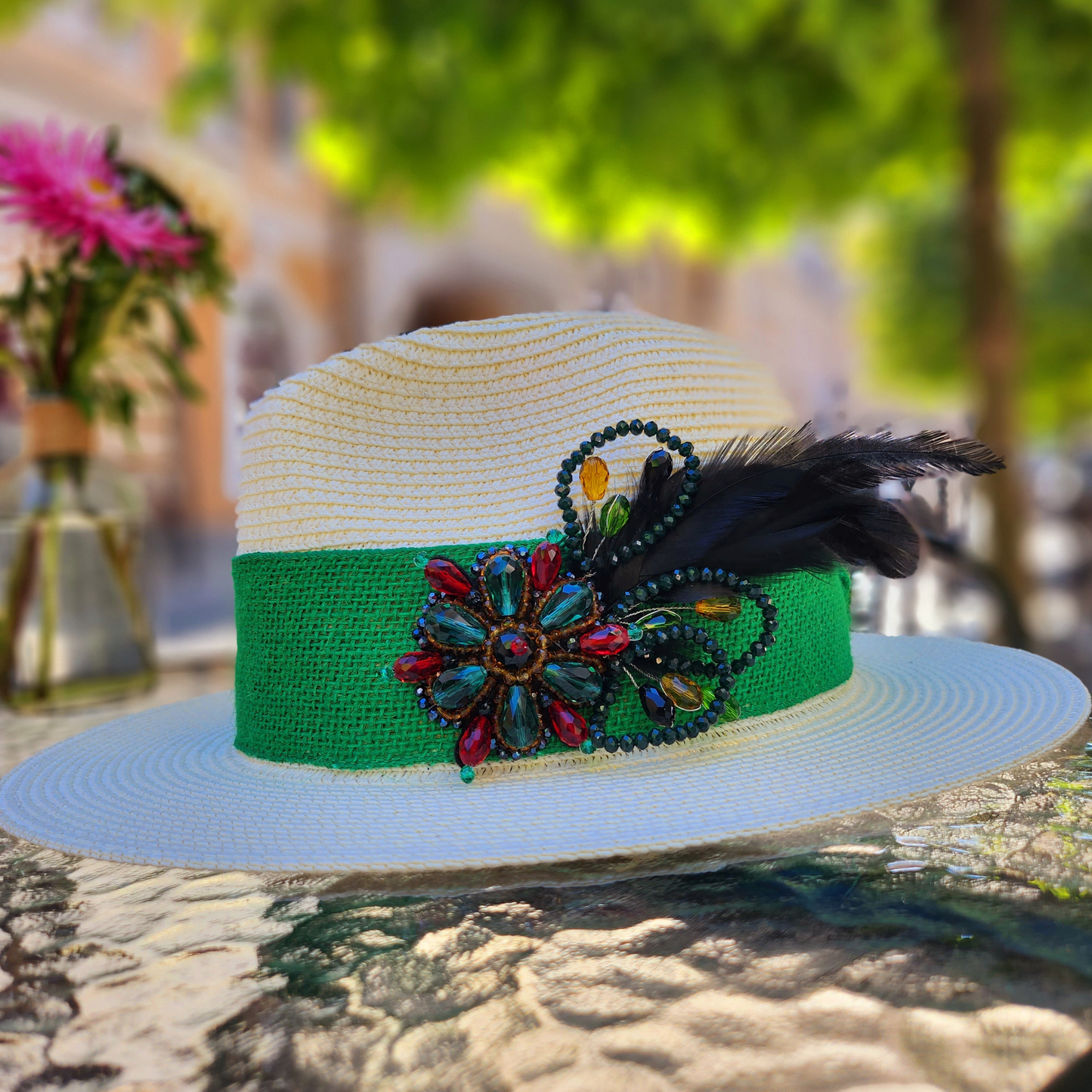 White Straw Fedora Hat with Feather Trim-side view of the hat, close-up of the feather brooch.