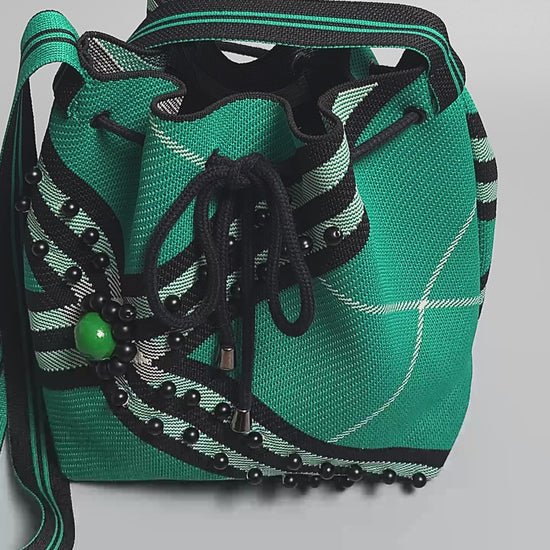 Black-Green Fabric Beaded Handbag-video finishing and embellishment of the bag close up