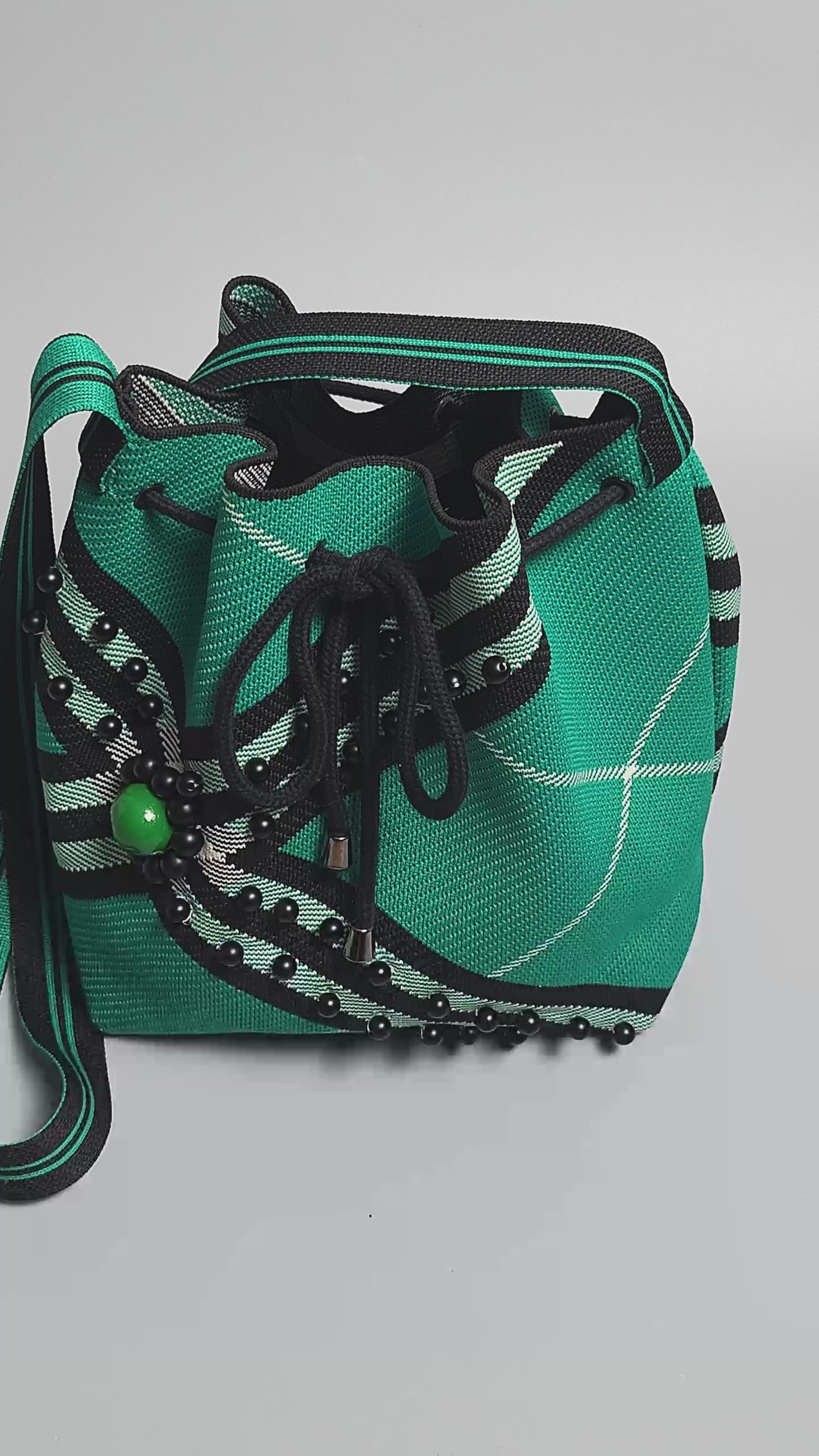 Black-Green Fabric Beaded Handbag-video finishing and embellishment of the bag close up